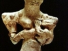 a-reptile-statue-holding-a-baby-4000-bc-iraq