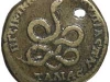 A brass coin of Plautilla showing a bearded serpent with a forked tail.